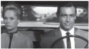 Description de l'image par IA : Deux personnes dans une voiture, une femme à gauche, un homme à droite tenant le volant.