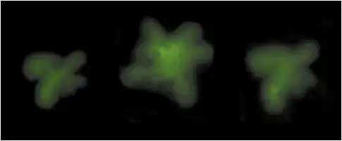 Description de l'image par IA : Trois formes lumineuses vertes floues sur fond noir.