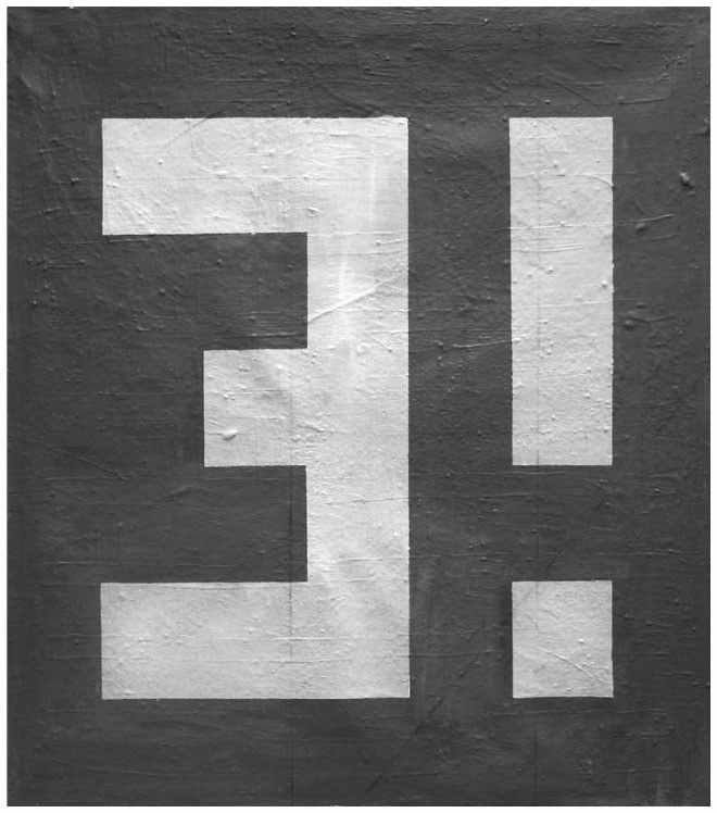 Description de l'image par IA : Carrés blancs disposés en forme de "T" sur fond sombre.