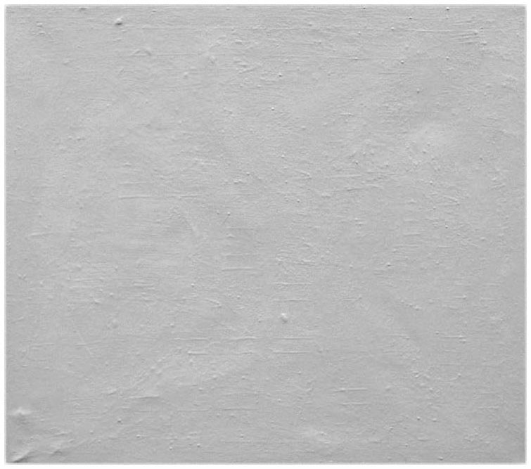 Description de l'image par IA : Surface grise et lisse avec quelques légères irrégularités.