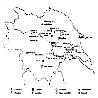 Description de l'image par IA : Carte avec divers symboles représentant des localités et des types de sol dans une région.
