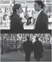 Description de l'image par IA : Deux personnes se font face dans une rue animée. Deux silhouettes marchent sous des lumières scintillantes.